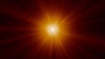 Orange rays of light flare outwards, making a sun-like effect ...