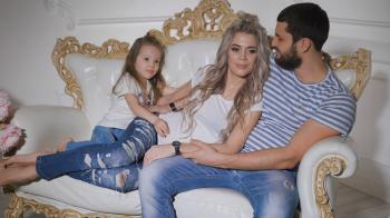 Happy family expecting new baby. Father, pregnant mother and little ...