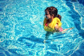 Little Girl Learning To Swim