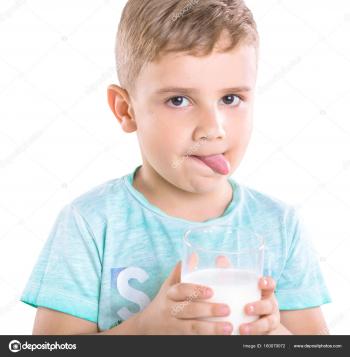 Close-up portrait of a charming little boy in blue T-shirt holds ...