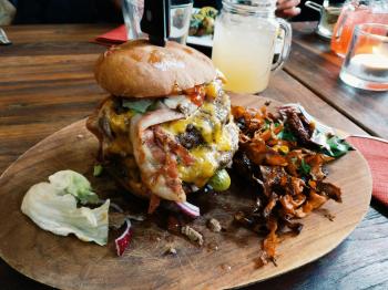 Loaded Burger on Wooden Plate