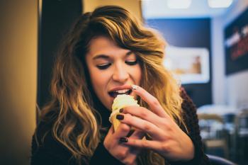 Long Blonde Haired Woman Eating Ice Cream