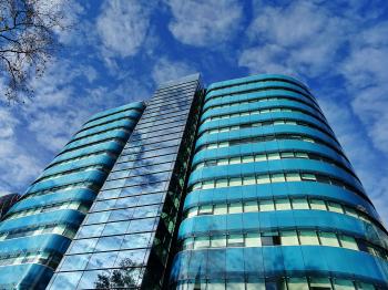 Low Angle Photography of Blue Tinted Glass Buildings