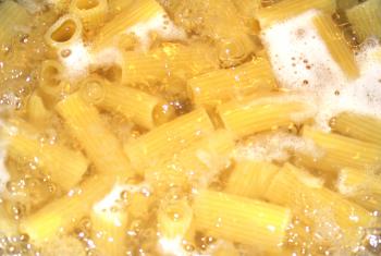 Macaroni being cooked on boiling water