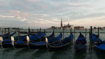 church of san giorgio maggiore and gondolas tied up at piazza san ...