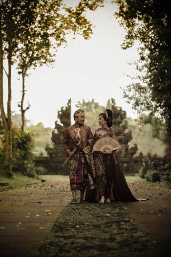 Man and Woman in Traditional Clothing Near Angkor Wat