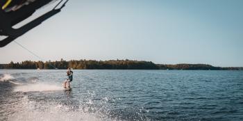 Man Holding Parachute With Wakeboard