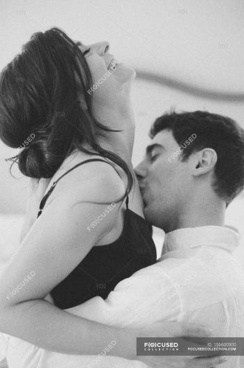 Man kissing woman clavicle — Stock Photo | #156600500