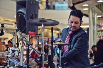Man Playing Drum Inside Mall