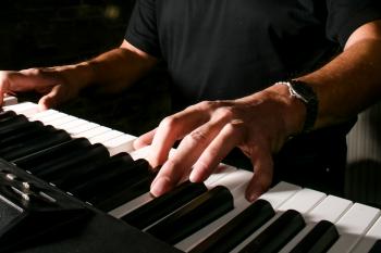 Man playing keyboard piano