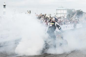 Man Riding Motorcycle With Smoke
