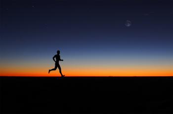 Man running alone at dawn
