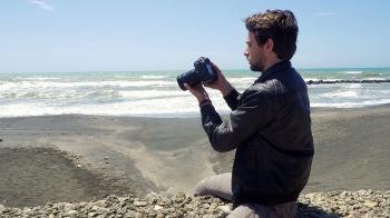 Asian man taking picture with professional camera Stock Video ...