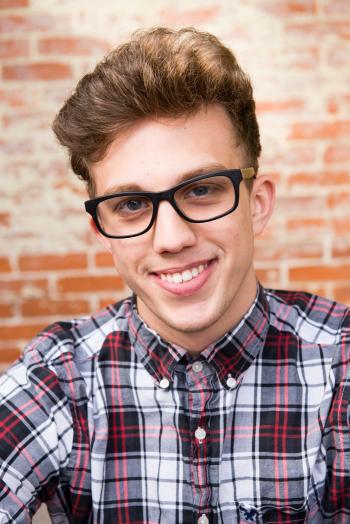 Man Wearing Eyeglasses And Smiling
