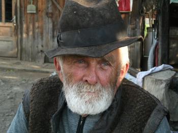 Man With White Beard Wearing Black Hat during Daytime