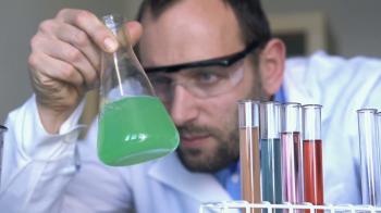 Chemist mixing chemicals in erlenmeyer flask HD Stock Video Footage ...