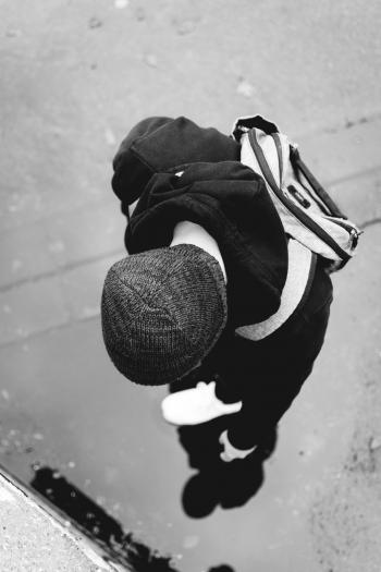 Monochrome Photography of a Person Wearing Beanie