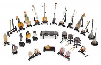 A COLLECTION OF TWENTY-SIX AGATE AND HARDSTONE MODELS OF MUSICAL ...