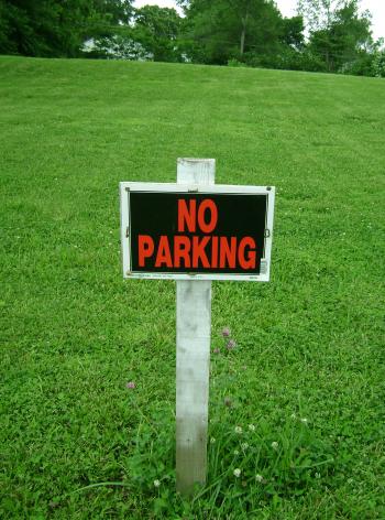 No parking sign on grass
