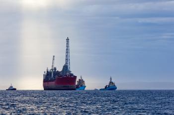 Oil and gas FPSO at sunset