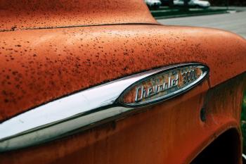 Old and rusty retro orange car