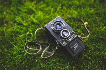 Old camera on the grass