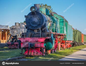 Old retro steam locomotive in summer. Vintage rustic green and red ...