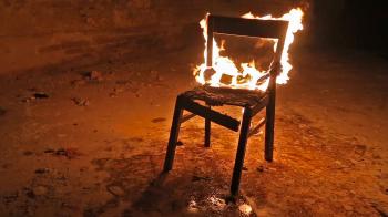 Chair on fire in an abandoned building Stock Video Footage - Videoblocks