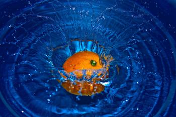 Orange Drop in Water in Time Laps Photography