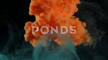 Stock Video: Orange Puff of Ink/Smoke Background ~ #77777449