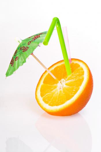 Orange with drinking straw