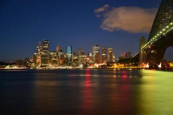 Panoramic Photography of Metropolis Next to Bridge during Night Time