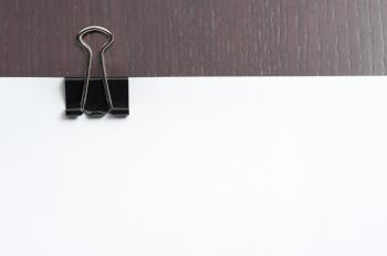 Free image of Paper clipped with a bankers clip