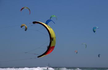 Paragliders flying in the sea