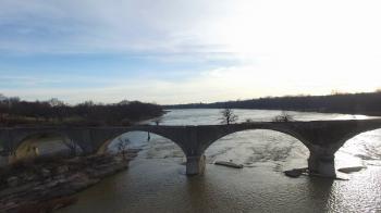 River flowing past abandoned bridge that is falling apart Stock ...