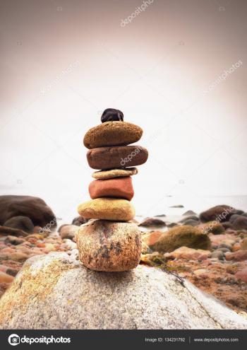 Stones pyramid symbolizing zen, harmony, balance pebbles. Ocean in ...