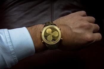 Person Wearing Round Gold Watch