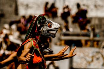 Person Wearing Traditional Mask Dancing