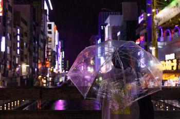 Photo of a Person Holding an Umbrella