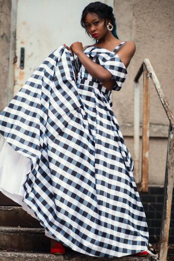 Photo of a Woman Wearing Gingham Dress