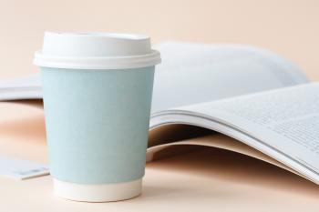 Photo of Coffee Cup Beside Book