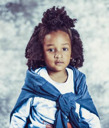Photo of Kid With Blue Scarf and White Long-sleeve Top