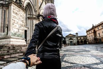Photo of Man Holding Woman's Hand