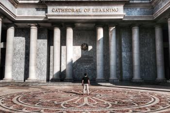 Photo of Person Standing in Front of Cathedral of Learning