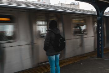 Photo of Woman Waiting at the Train Station