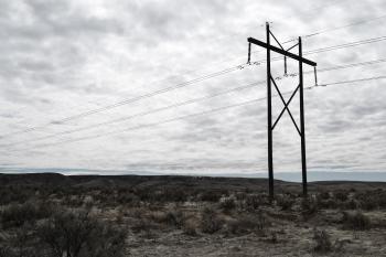Photograph of Electrical Post on Cloudy Day