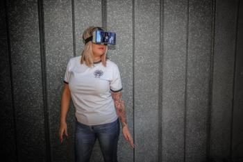 Photograph of Woman Wearing Vr Glass in Front of Wall