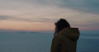 Adventure Woman taking photo of sunset ocean view with smartphone ...