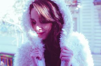 Photography of a Woman in White Fur Coat