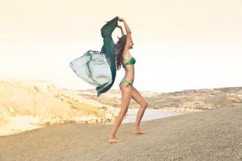 Photography of a Woman Wearing Green Bikini
